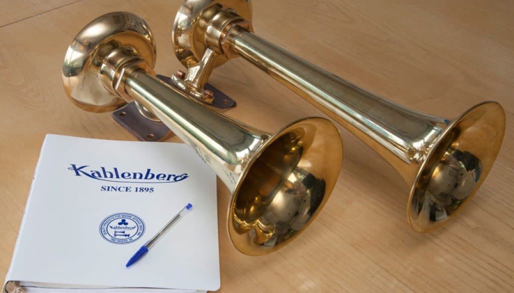 Two Kahlenberg marine horns beside a Kahlenberg brochure