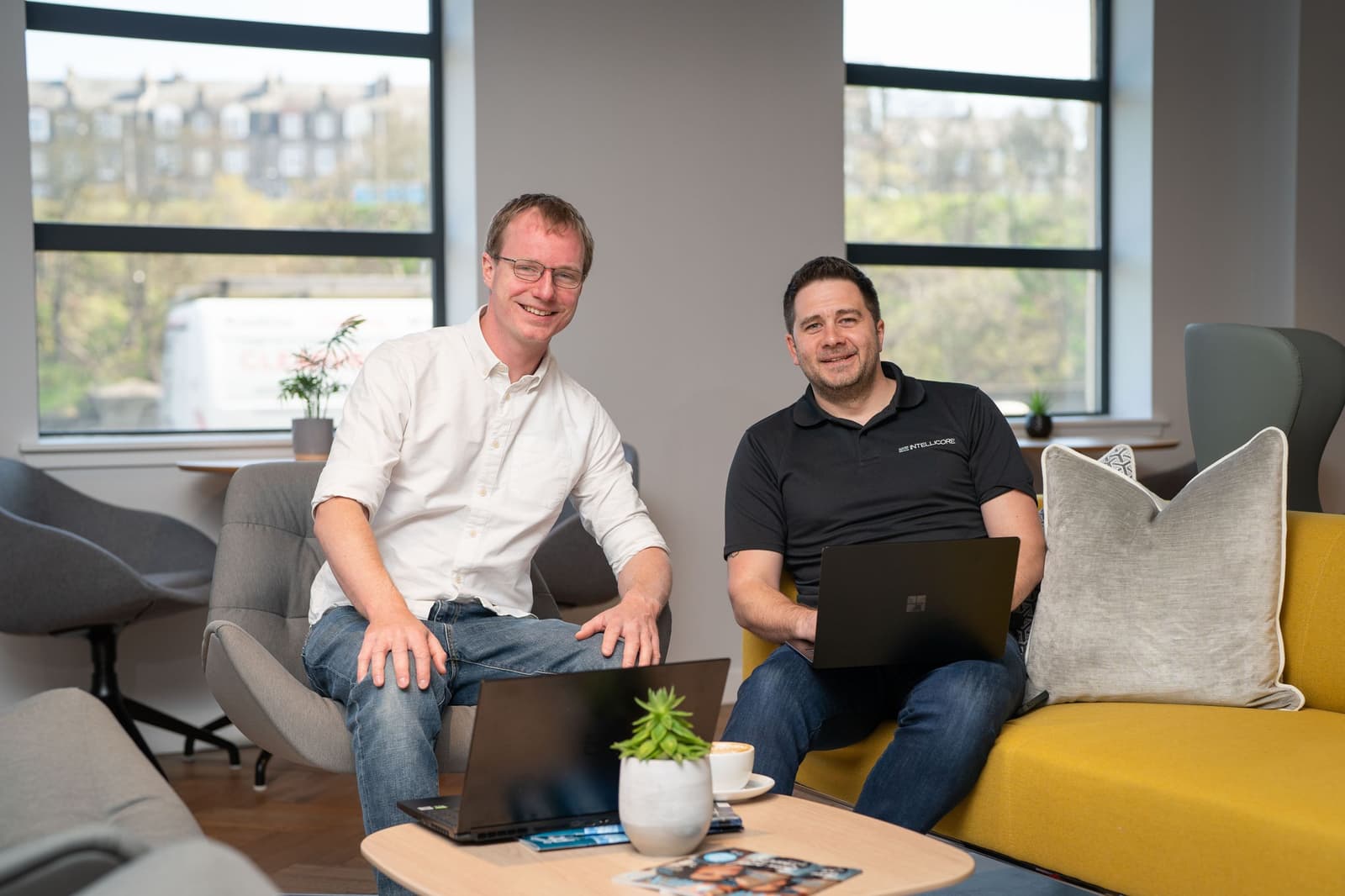 Toby du Pré with an Intellicore representative in their office